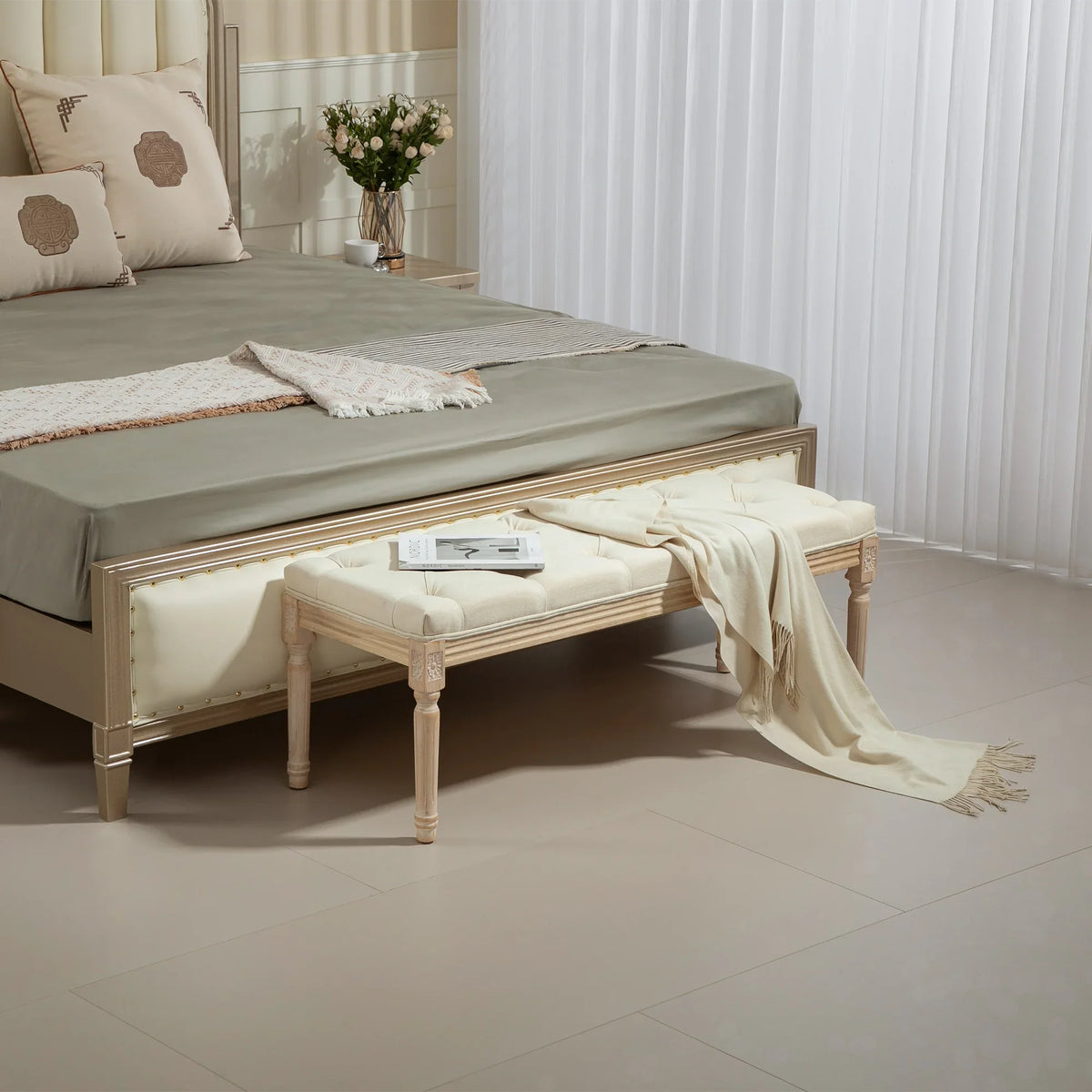 Cream button-tufted wooden bed end bench with distressed frame and cushioned top