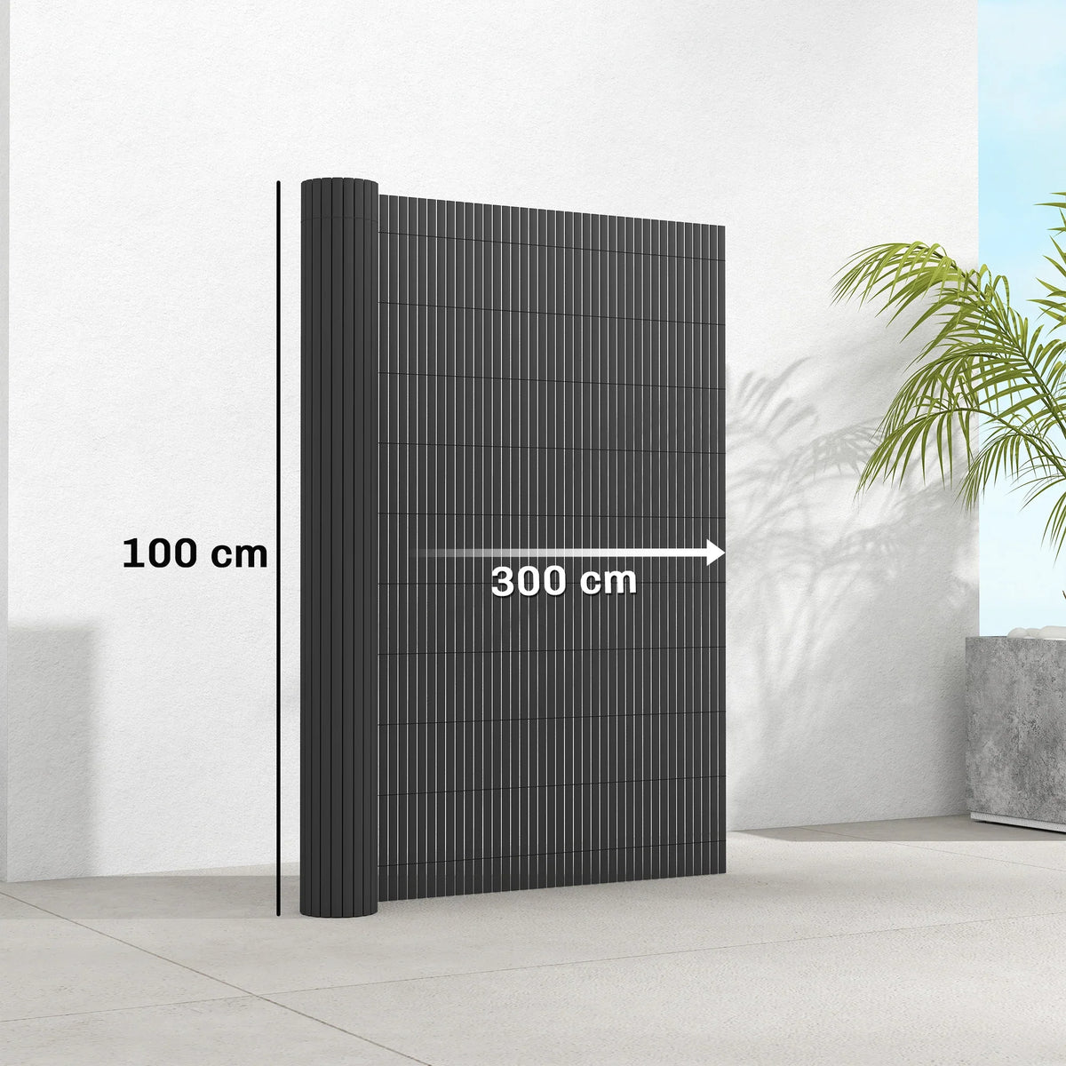 Dark grey plastic privacy screening fence panel with vertical slats, freestanding.