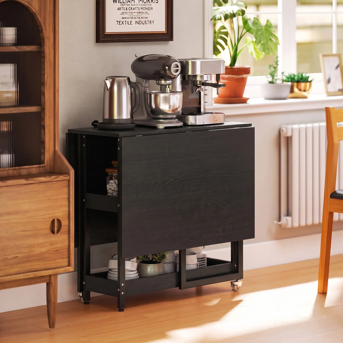 Black drop-leaf dining table with side storage cabinet and metal frame