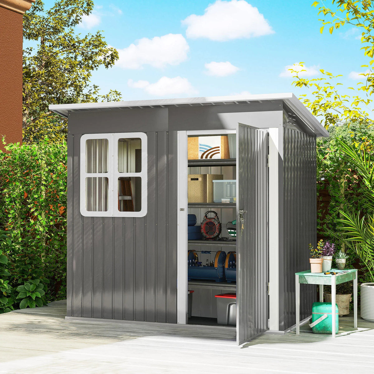 Grey metal garden shed with double doors and window, open interior with shelves