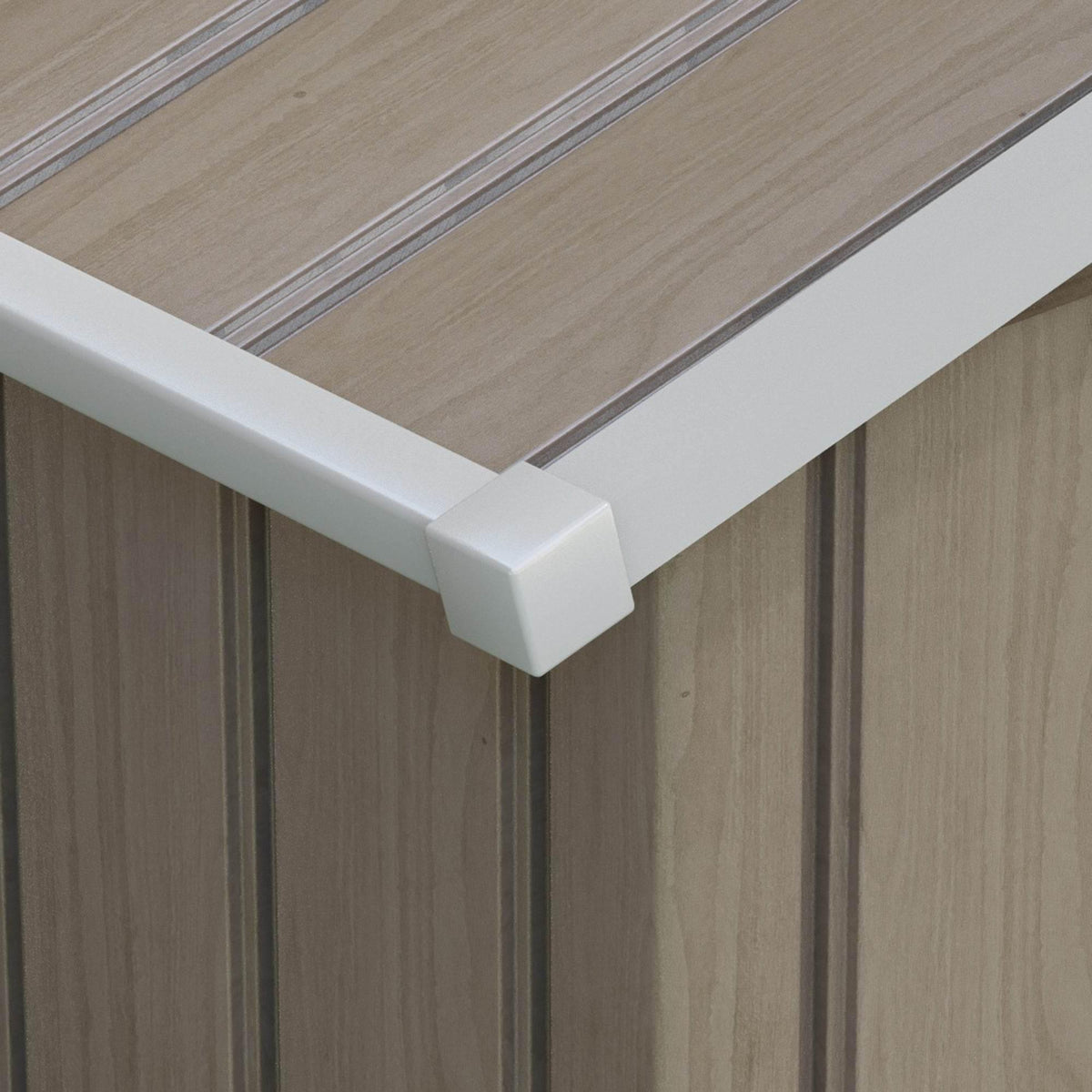 Brown metal shed corner with white trim gutter along the roof edge