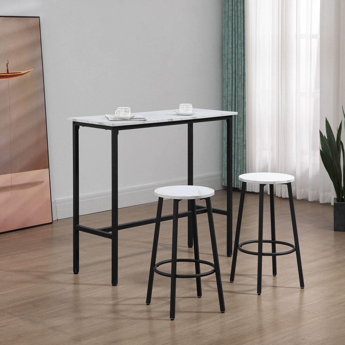 Black-framed bar table with white marble-effect top and two white round stools