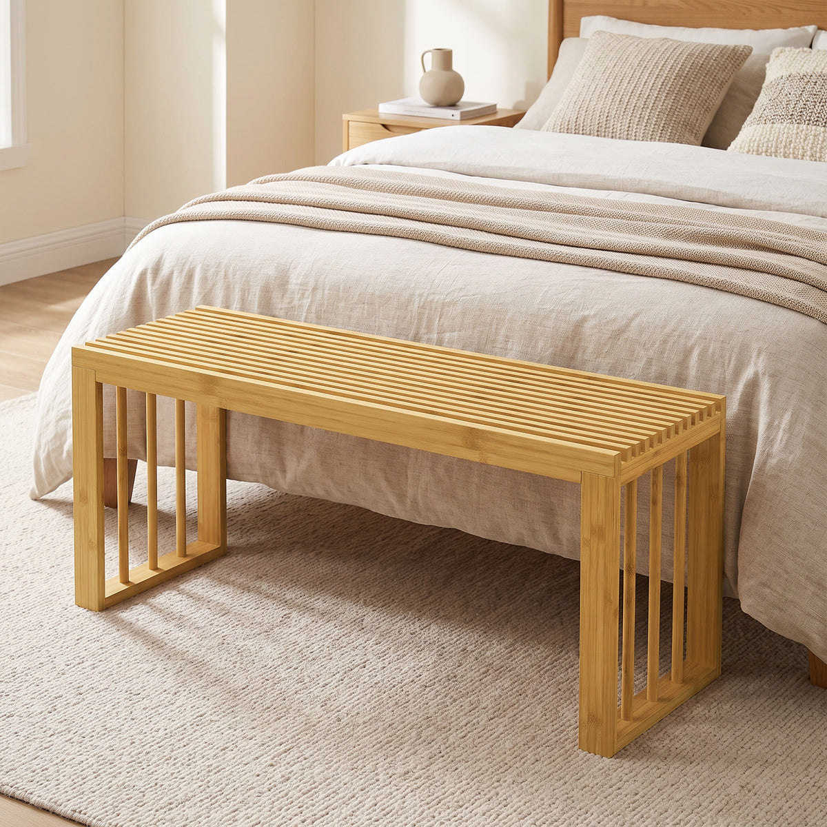 Bamboo bench used as a bed bench with slatted seat and open shoe storage base