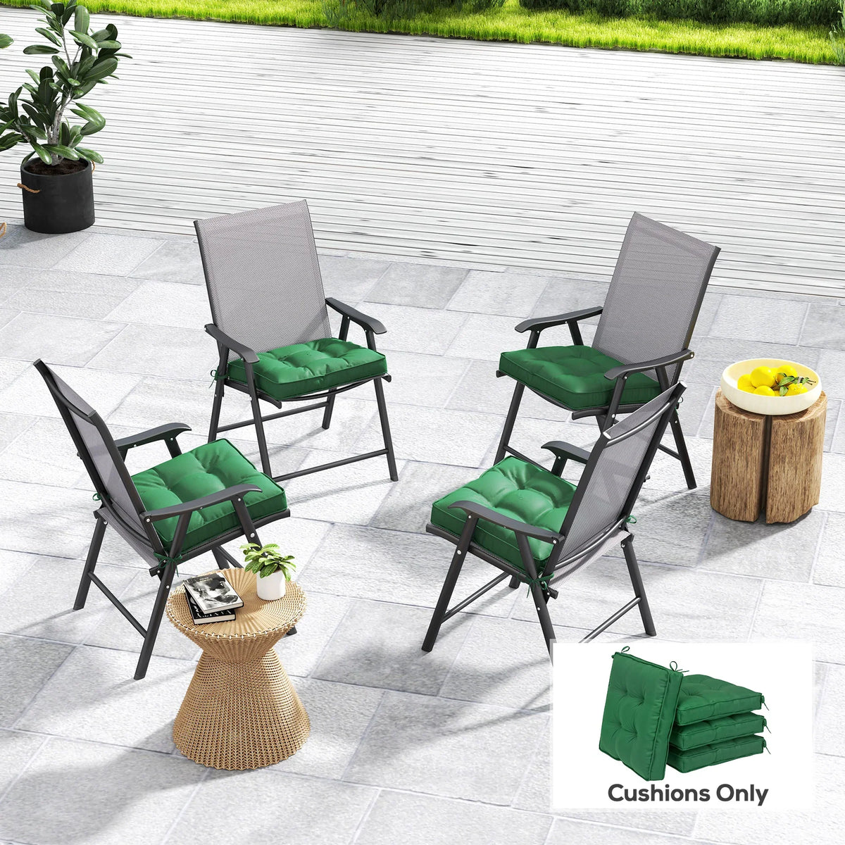Four green outdoor seat cushions with tufted tops on black patio chairs
