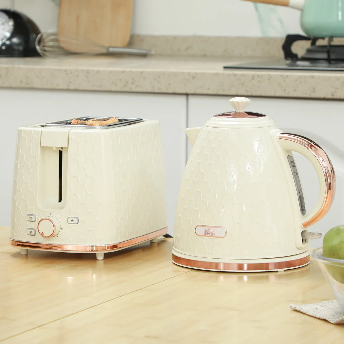 Beige electric kettle and 2-slice toaster set with honeycomb texture.