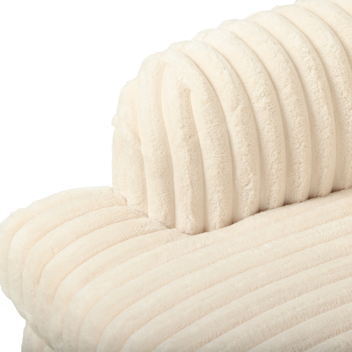 Close-up of cream corduroy armchair back and arm with ribbed vertical stitching