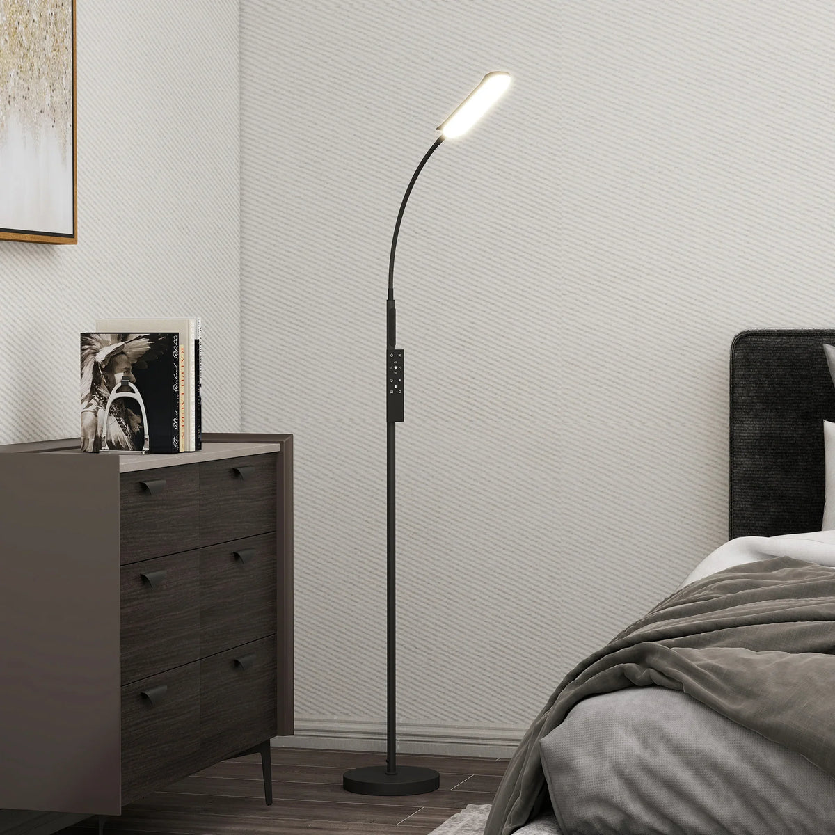 Black LED floor lamp with slim gooseneck and round standing base