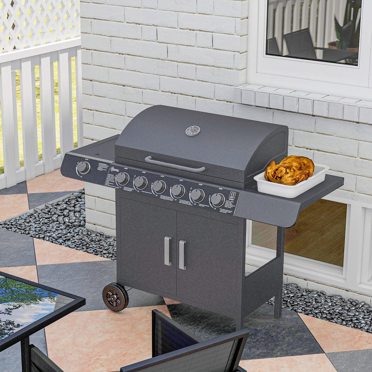 Grey gas BBQ grill on patio near a brick wall with side tray of cooked food