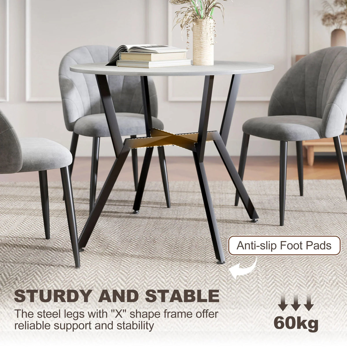 Round grey dining table with black steel frame and anti-slip foot pads detail