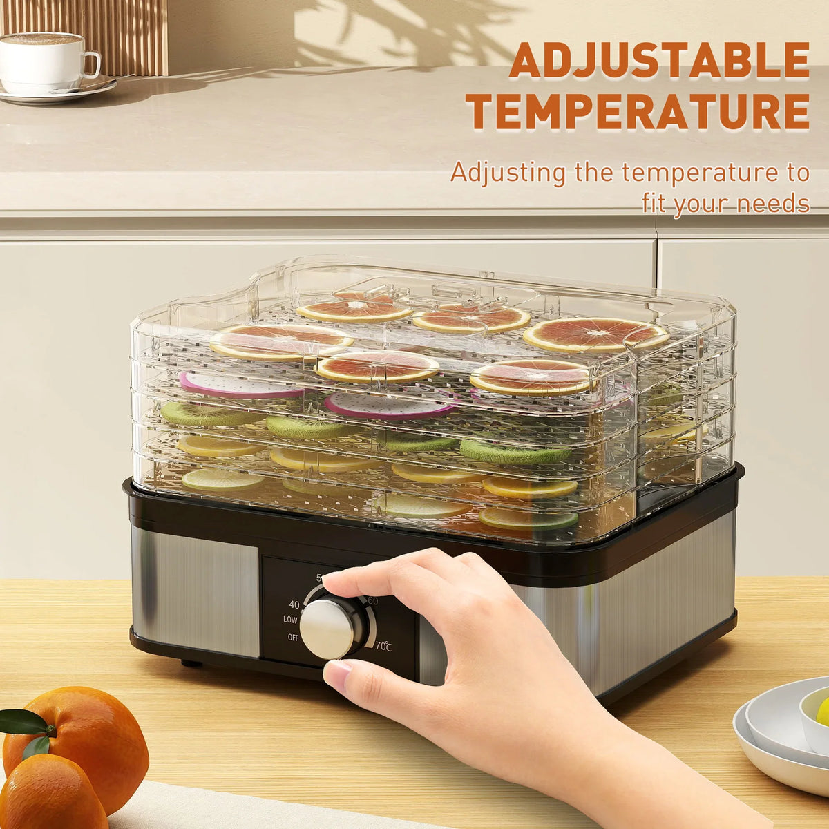 Food dehydrator with adjustable temperature dial and clear stack trays filled with fruit slices.