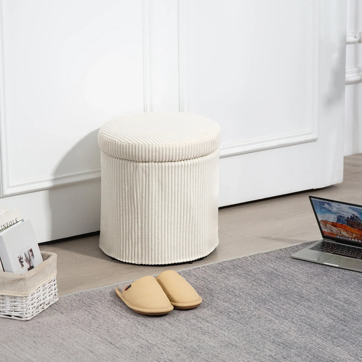Beige corduroy round storage ottoman with removable lid and short legs