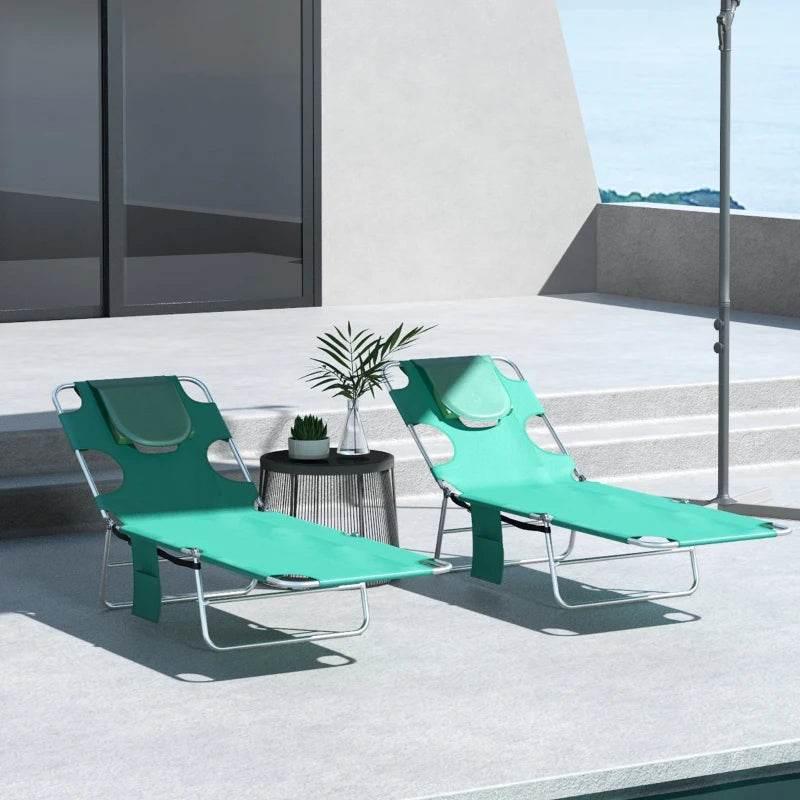 Set of 2 foldable green sun loungers with padded headrests and reclining backrests