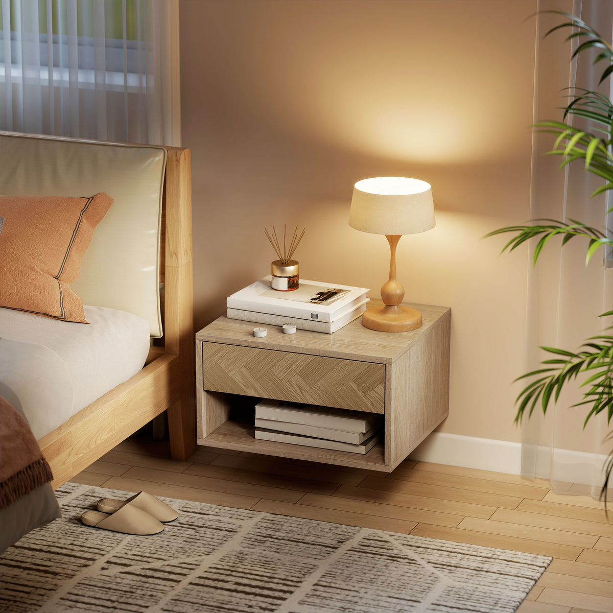 Natural wood bedside table with drawer and open shelf holding lamp and books