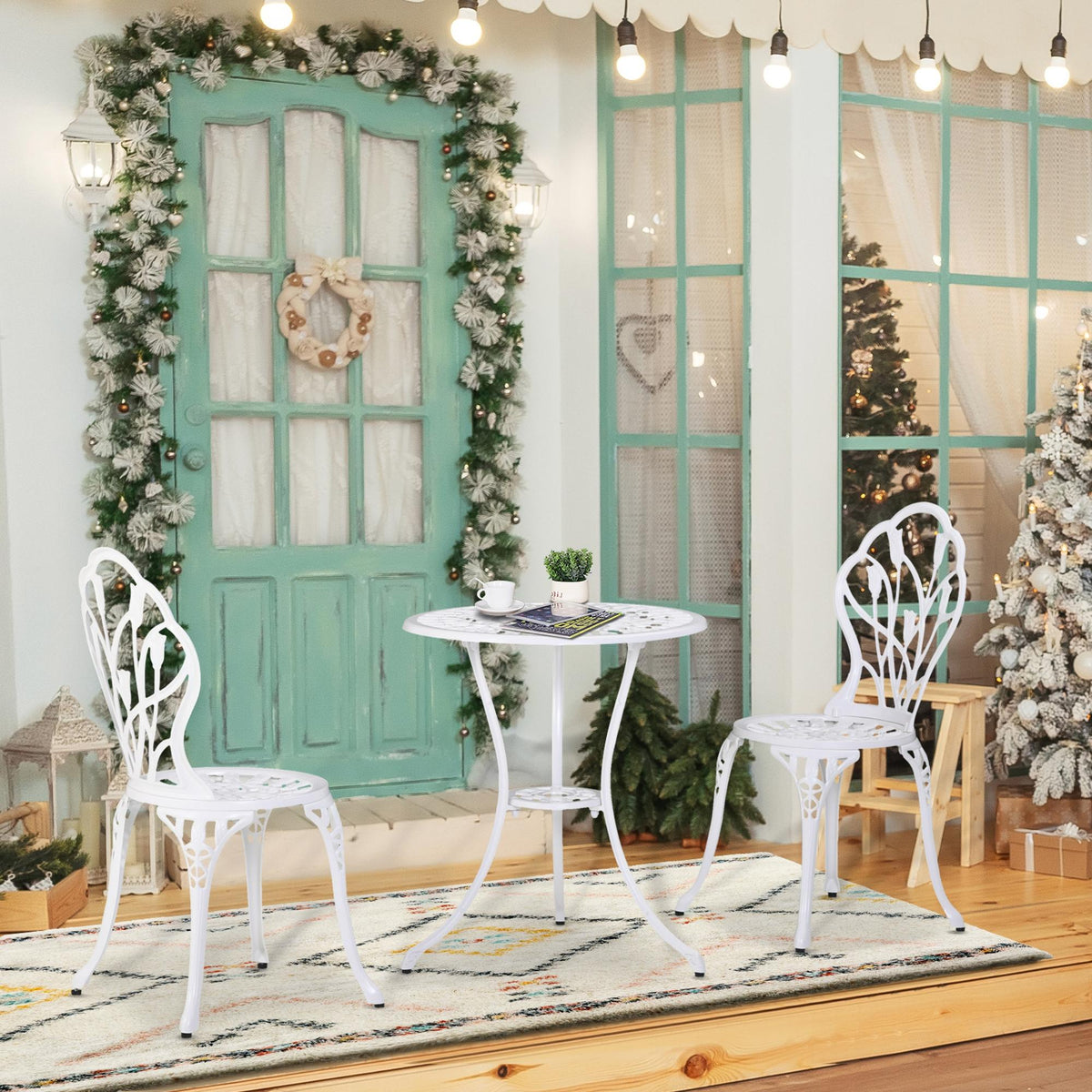 White outdoor bistro set with round pedestal table and 2 ornate back chairs