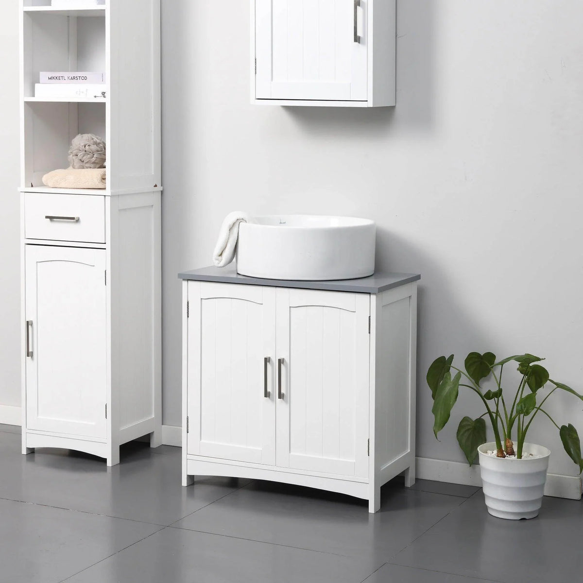 White under-sink cabinet with double doors and center drawer storage side unit