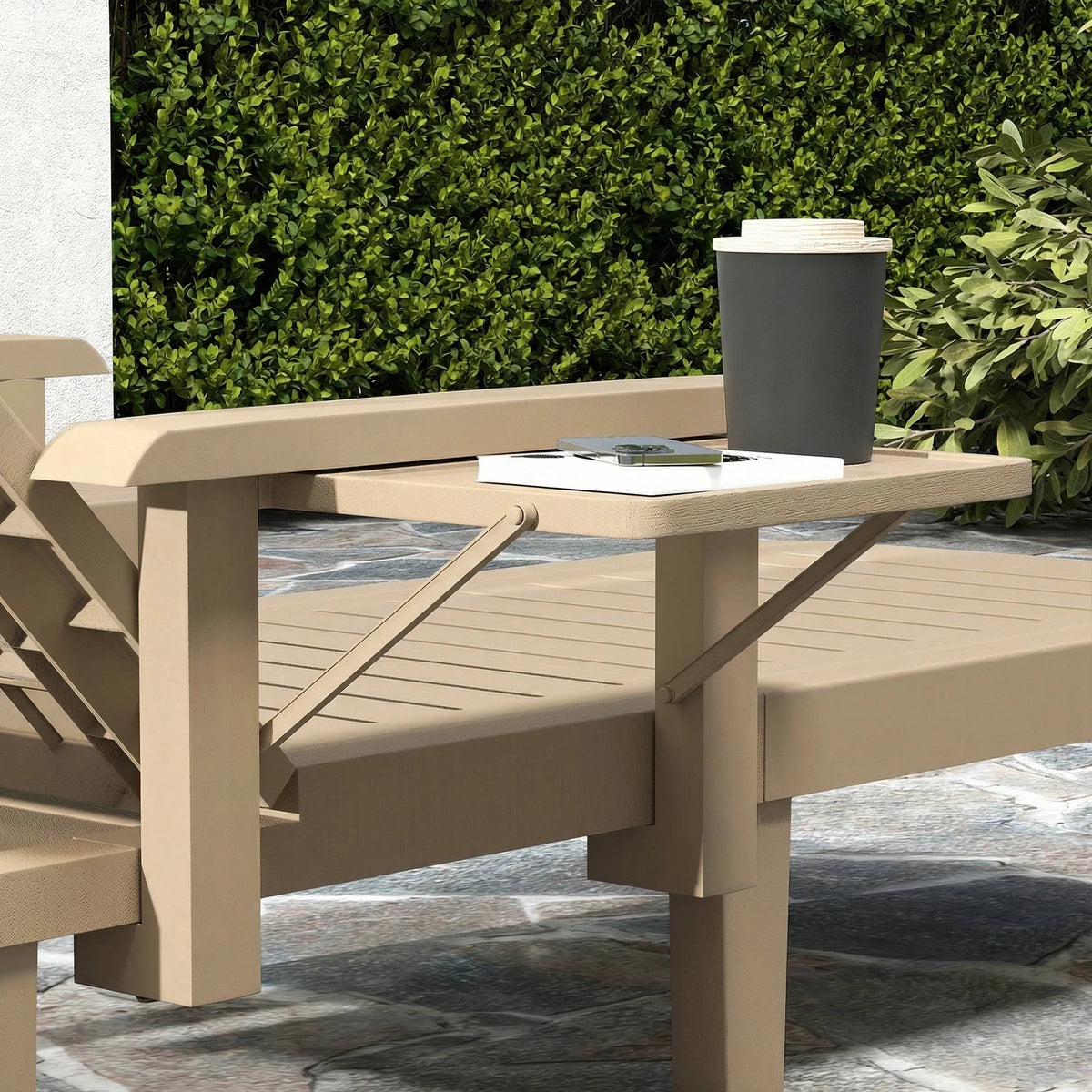 Khaki reclining sun lounger frame with armrest support and tabletop, close-up