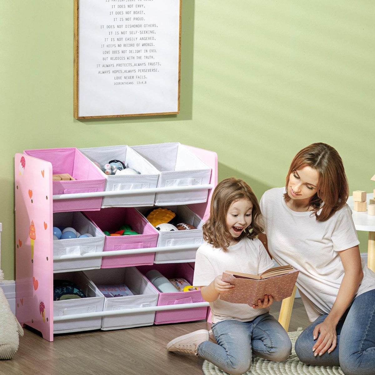 Pink kids storage cabinet with open compartments and removable white baskets