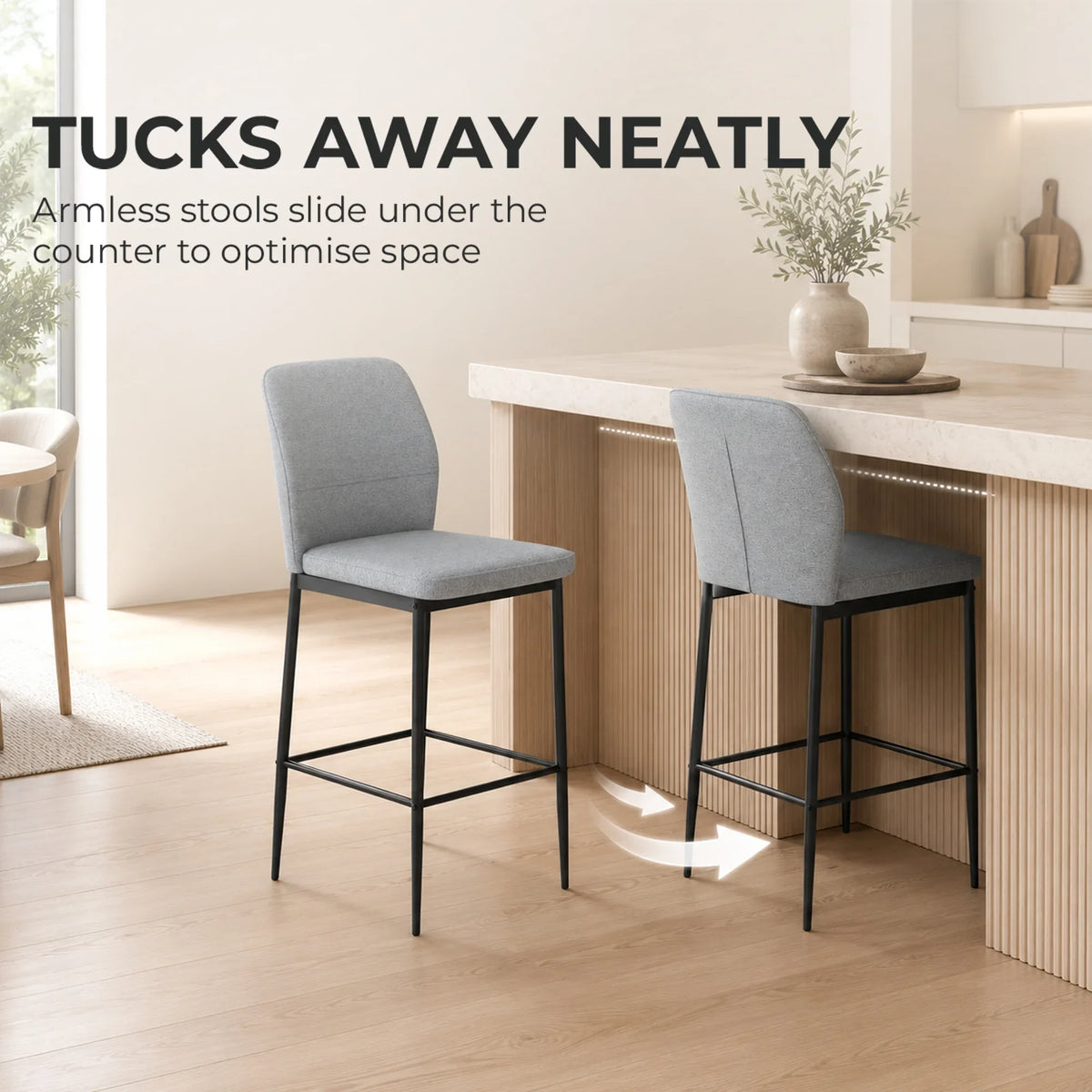 Pair of grey velvet bar stools with backrests, footrests, and slim black frames
