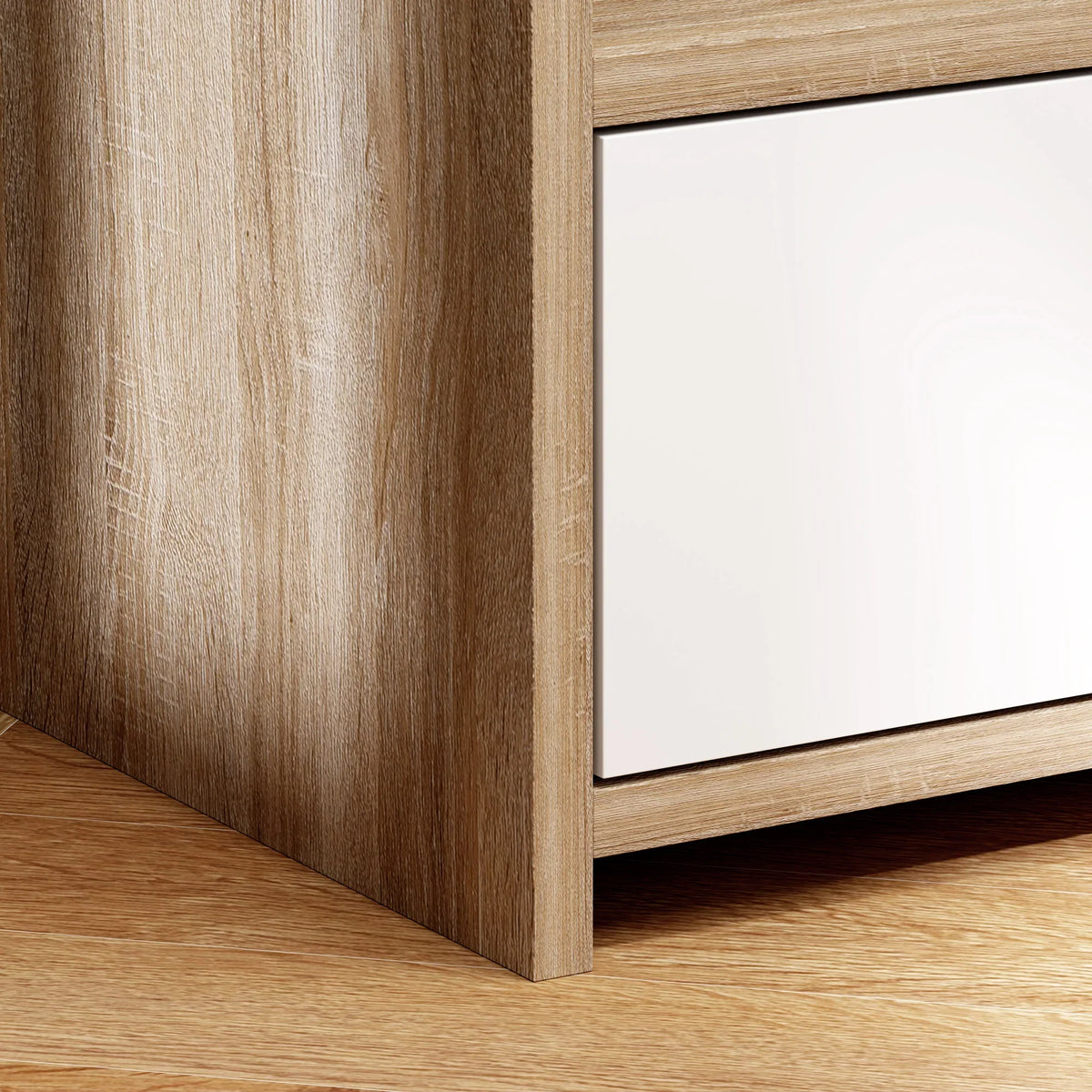 Close-up of wood-effect side panel and white drawer front of the bedside table.