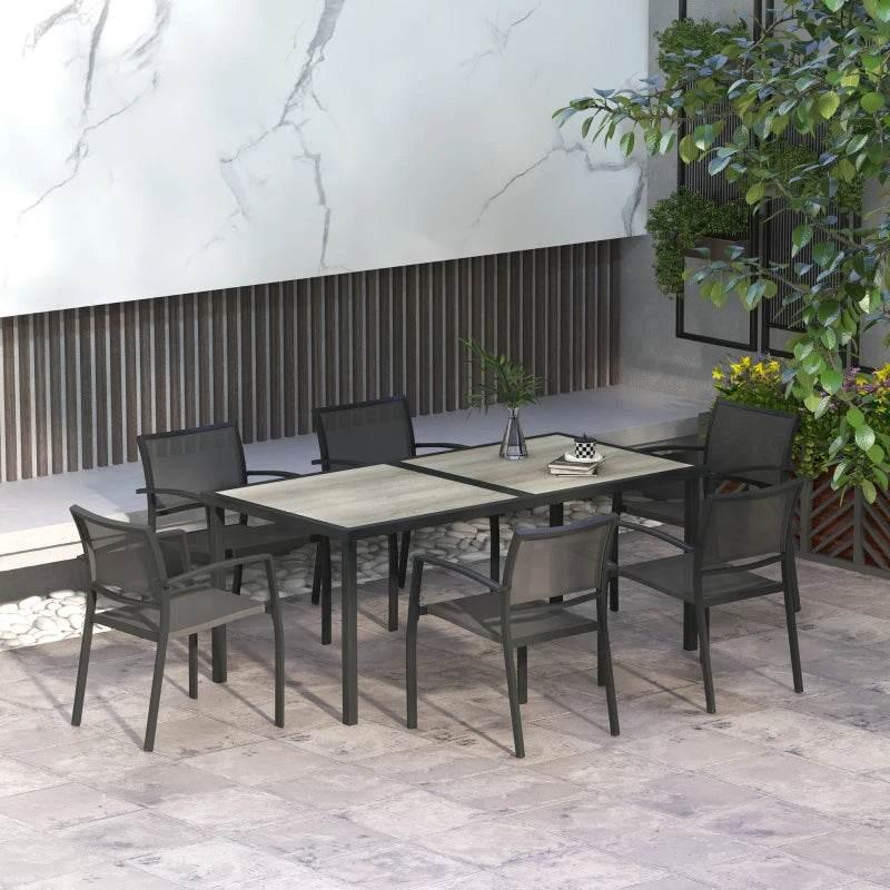 Grey outdoor dining set with rectangular table and stackable mesh chairs