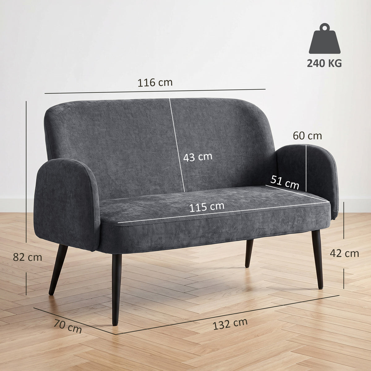 Dark grey velvet loveseat with rounded arms and slim tapered metal legs