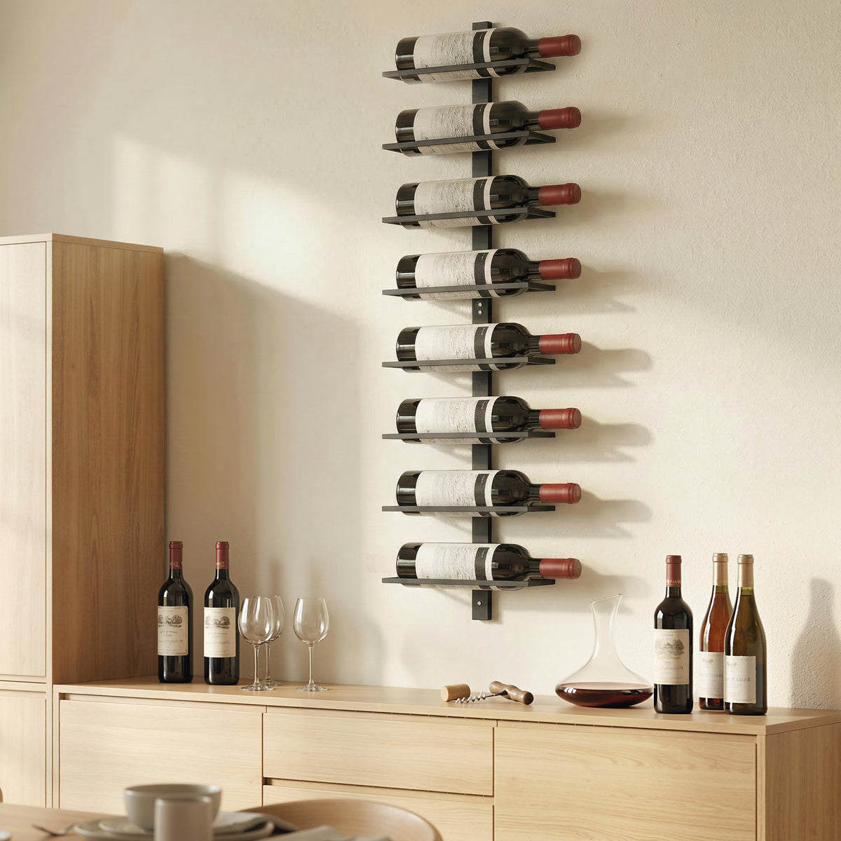 Black metal wall-mounted wine rack with open tiers holding wine bottles