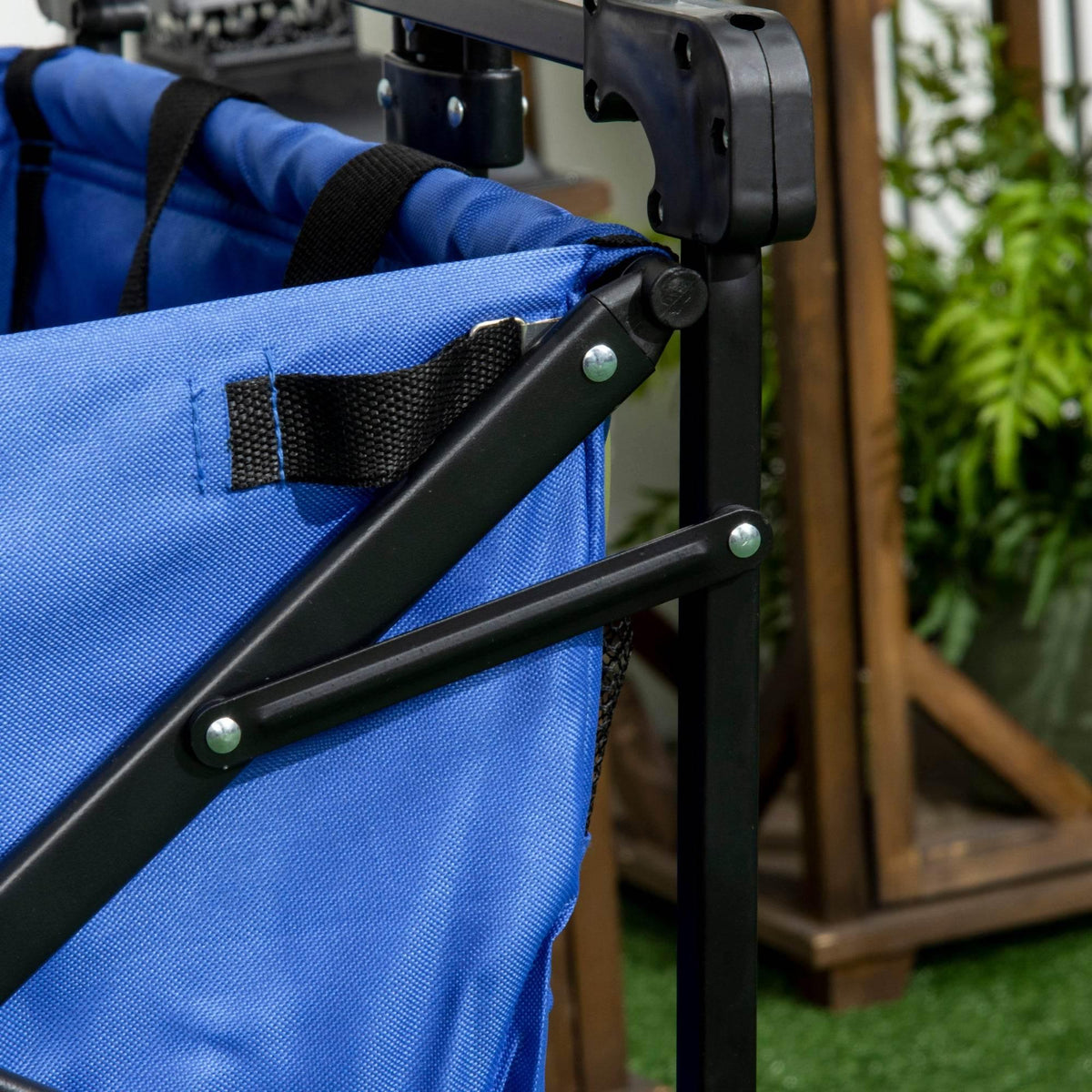 Blue collapsible beach wagon with adjustable pull handle and fabric strap detail
