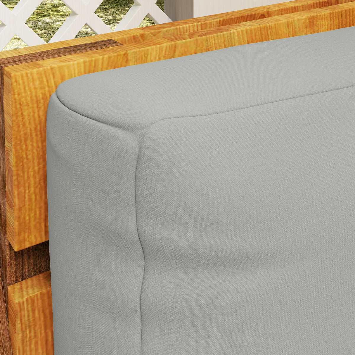 Light grey cushion corner detail with rounded seam and textured fabric surface