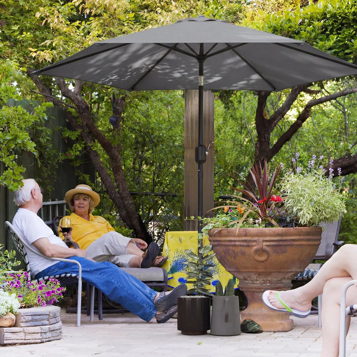 Grey garden parasol umbrella with adjustable tilt canopy and central aluminium pole