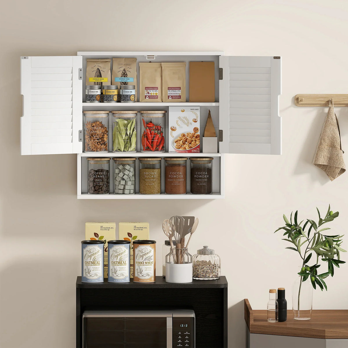 White wall cabinet with louvered doors and multi-compartment shelves for pantry-style items