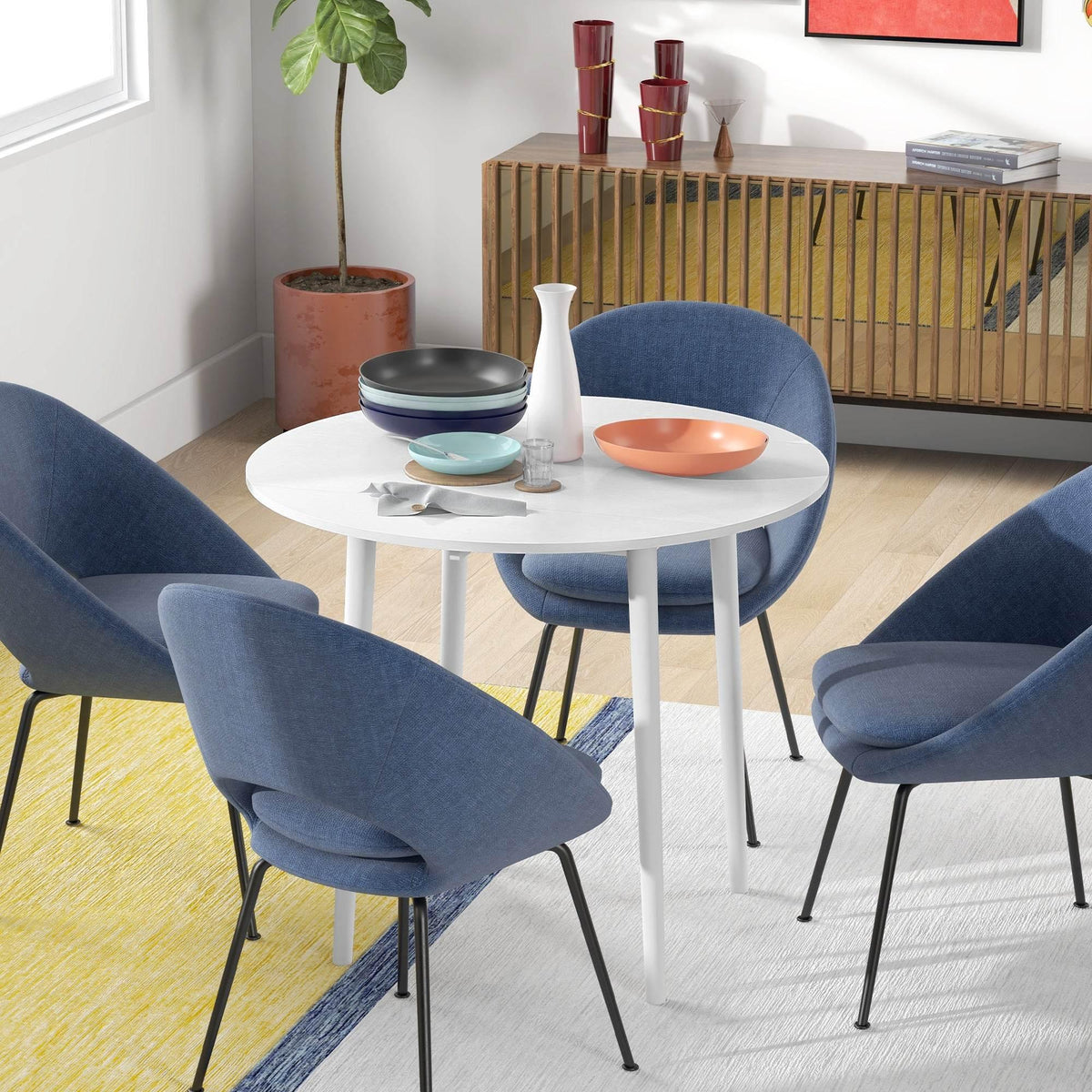 White round drop-leaf dining table with wooden legs in compact size