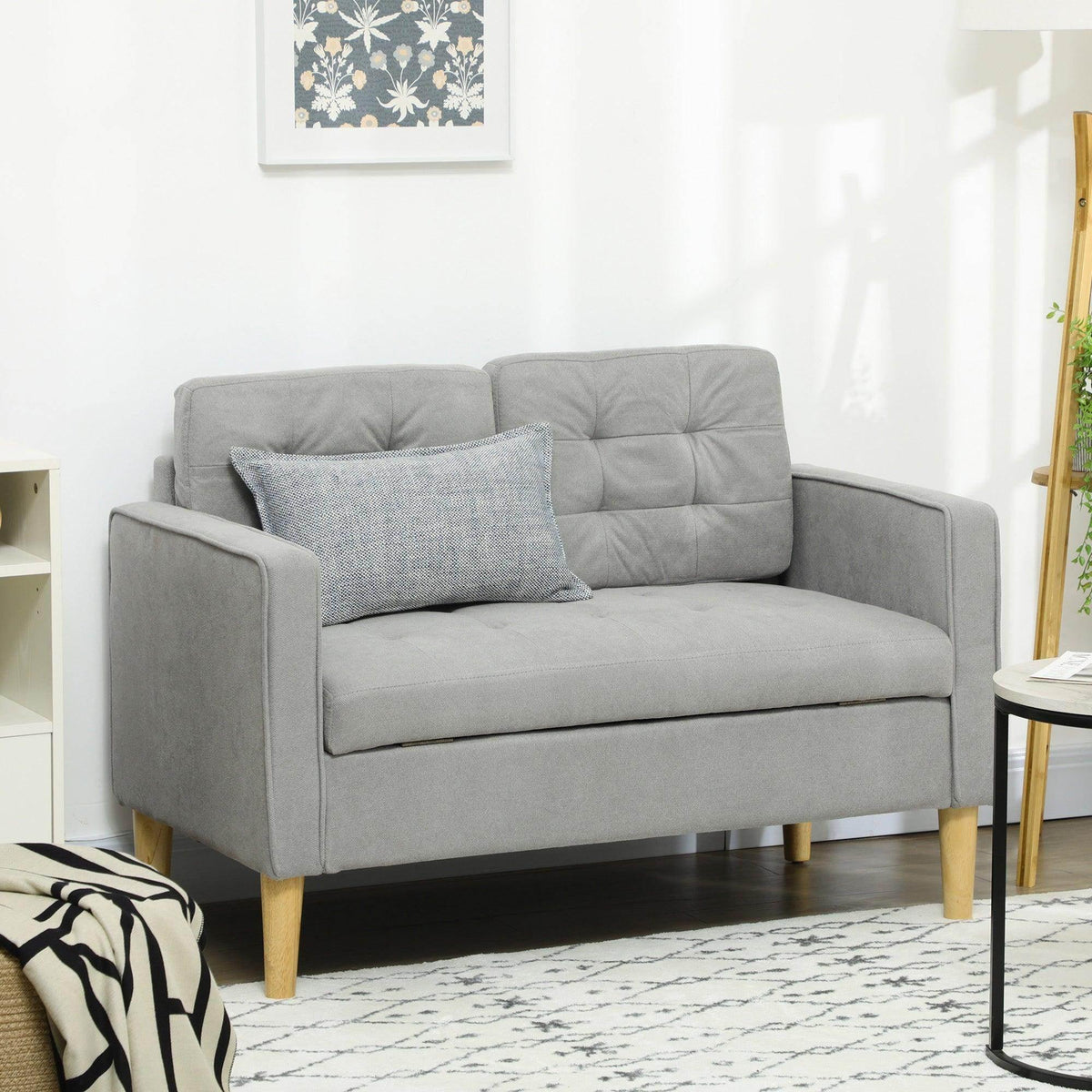 Light grey 2-seater loveseat sofa with padded seat, tufted back, and wooden legs