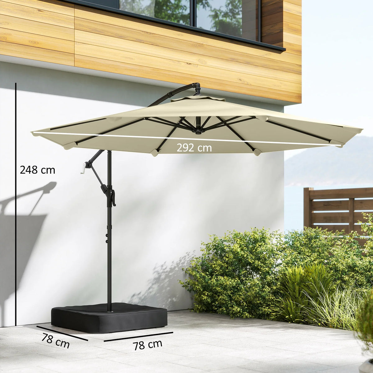 Beige cantilever garden parasol with cross base and black metal pole, open canopy