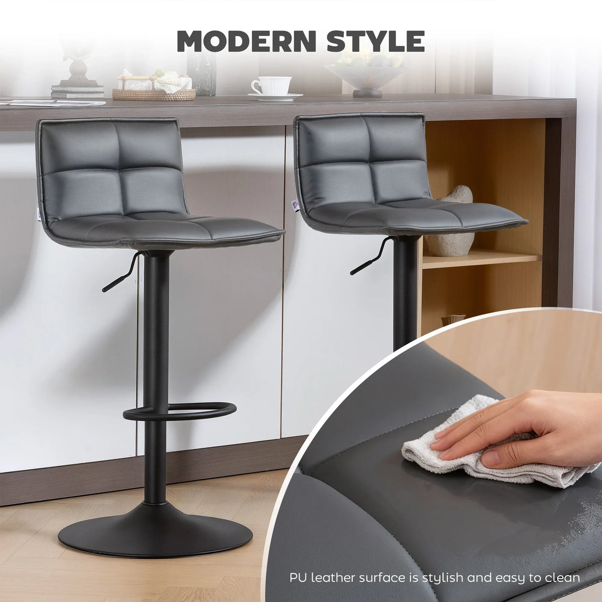 Two dark grey faux leather bar stools with swivel seats, shown with a cleaning wipe