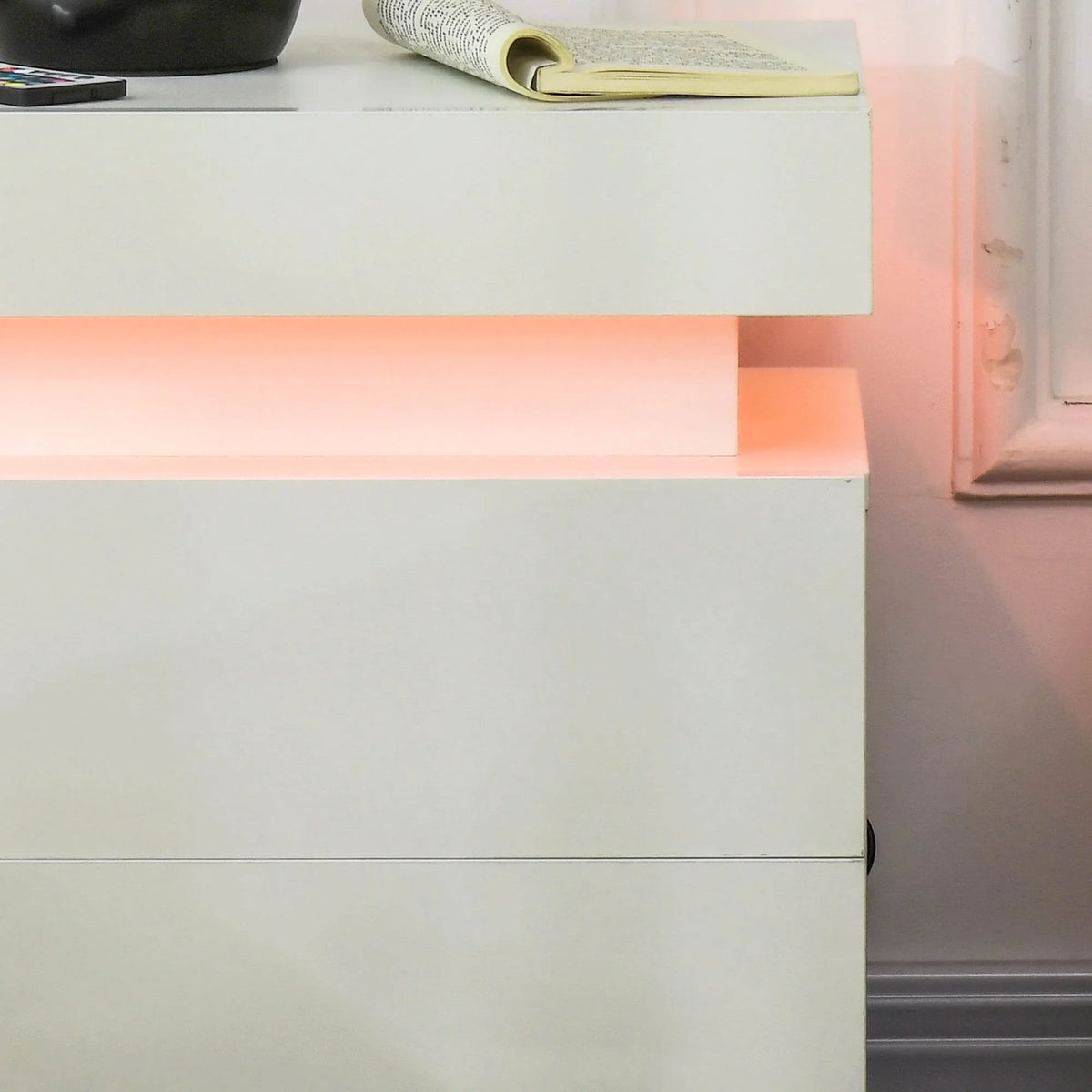 White high-gloss drawer front with clean seam line and smooth cabinet edges