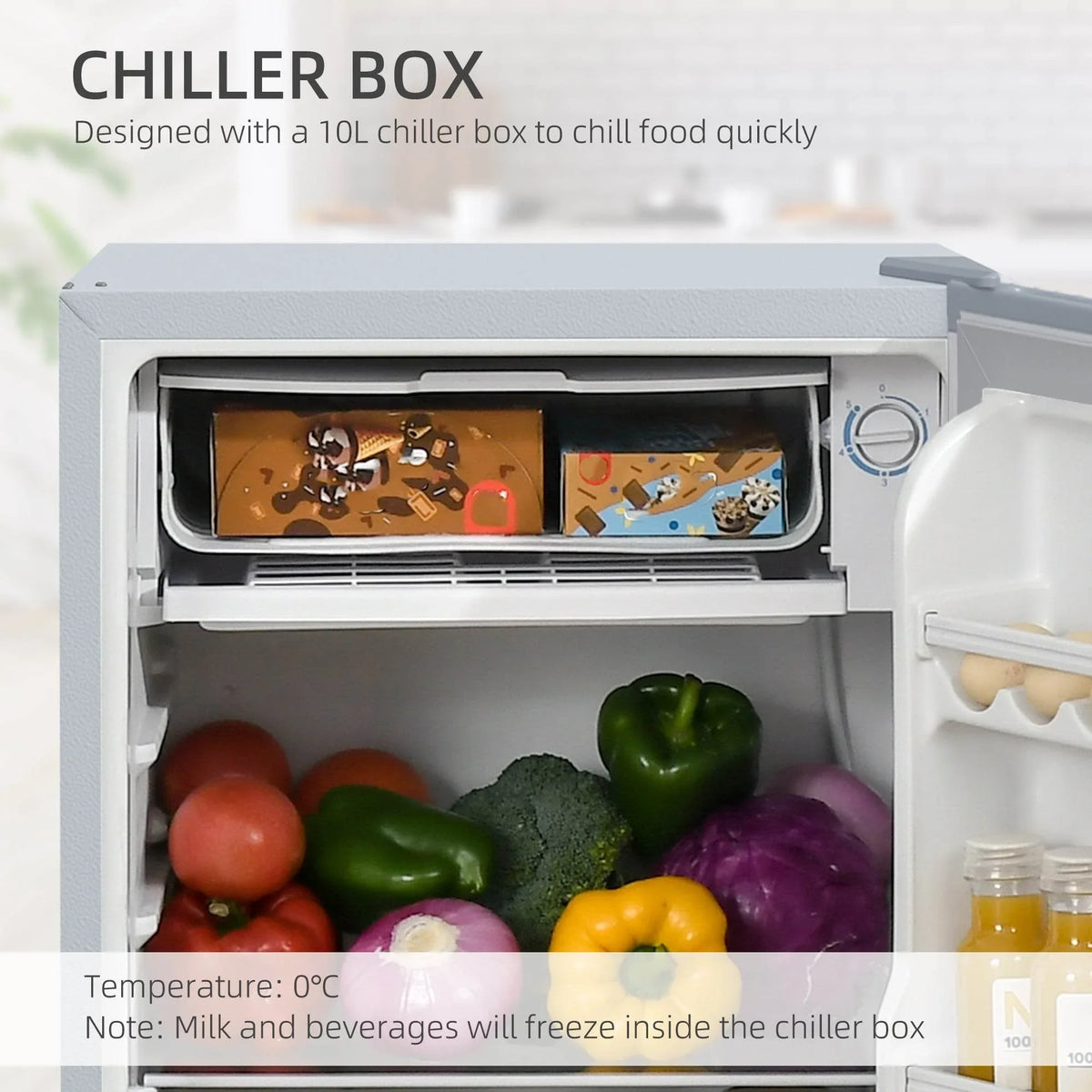 Refrigerator chiller box open with fruit and container on the shelf
