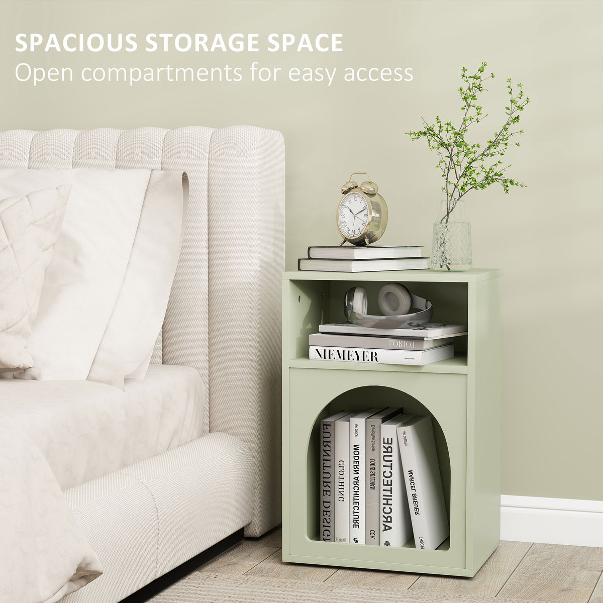Green bedside table with open compartments and arched lower storage, box frame.