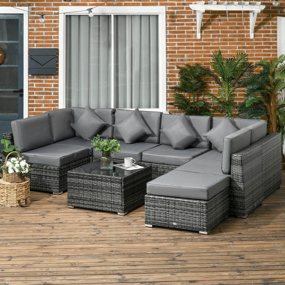 Grey rattan patio sofa set with corner sectional cushions and ottoman bench