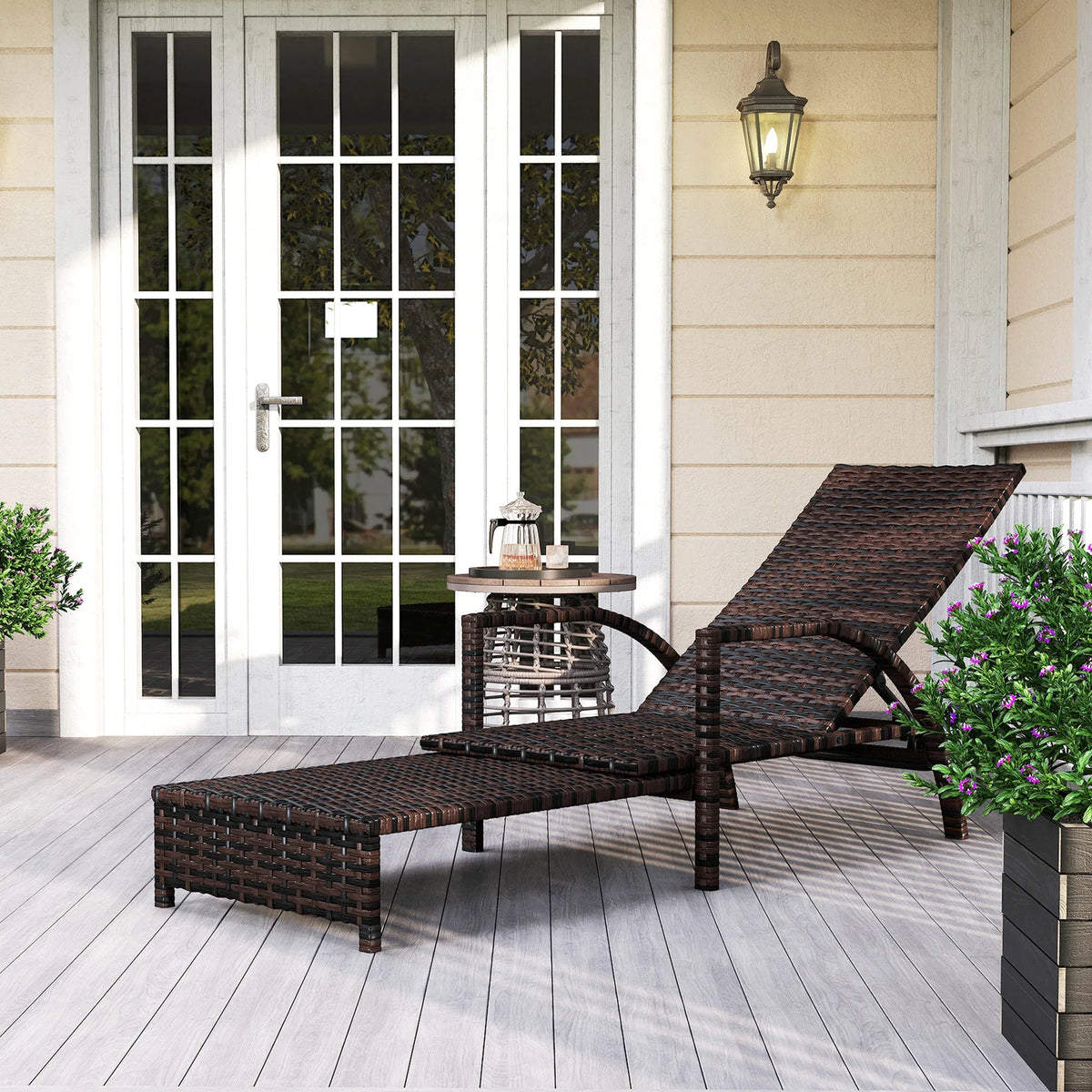Brown rattan reclining lounger with extending footrest and adjustable backrest, outdoor chaise style