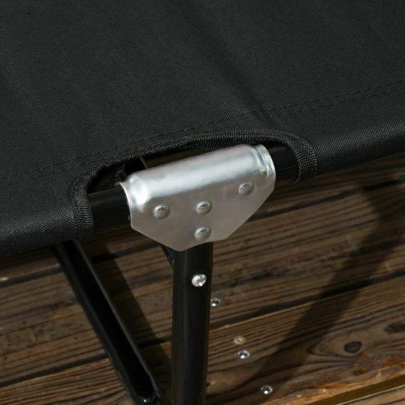 Close-up of black metal folding lounger frame with silver connector hardware