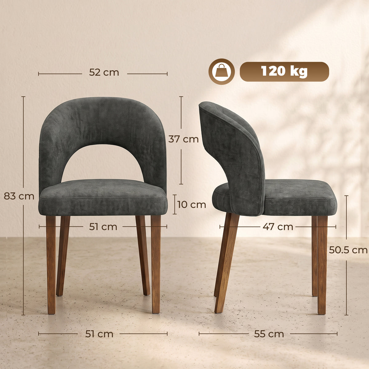 Pair of dark grey upholstered dining chairs with arched backs and wooden legs