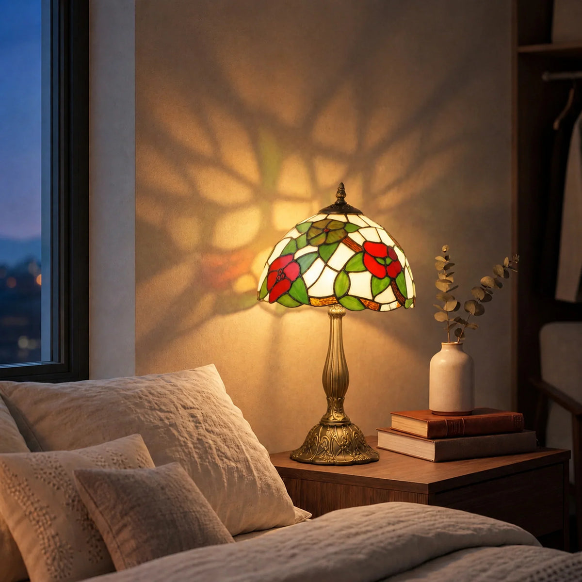 Stained glass table lamp with red flower and green leaf shade and brass pedestal base