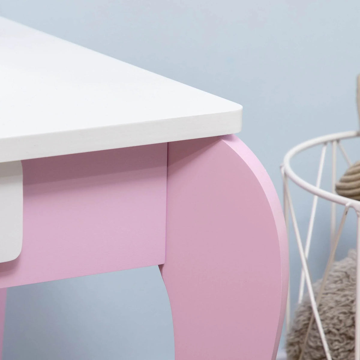 Curved pink vanity table leg with under-shelf panel and smooth white tabletop edge