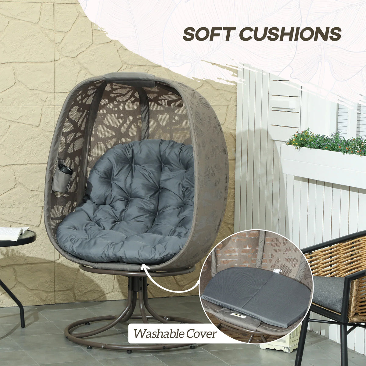 Swivel egg lounge chair with soft blue-gray cushions and dark patterned canopy