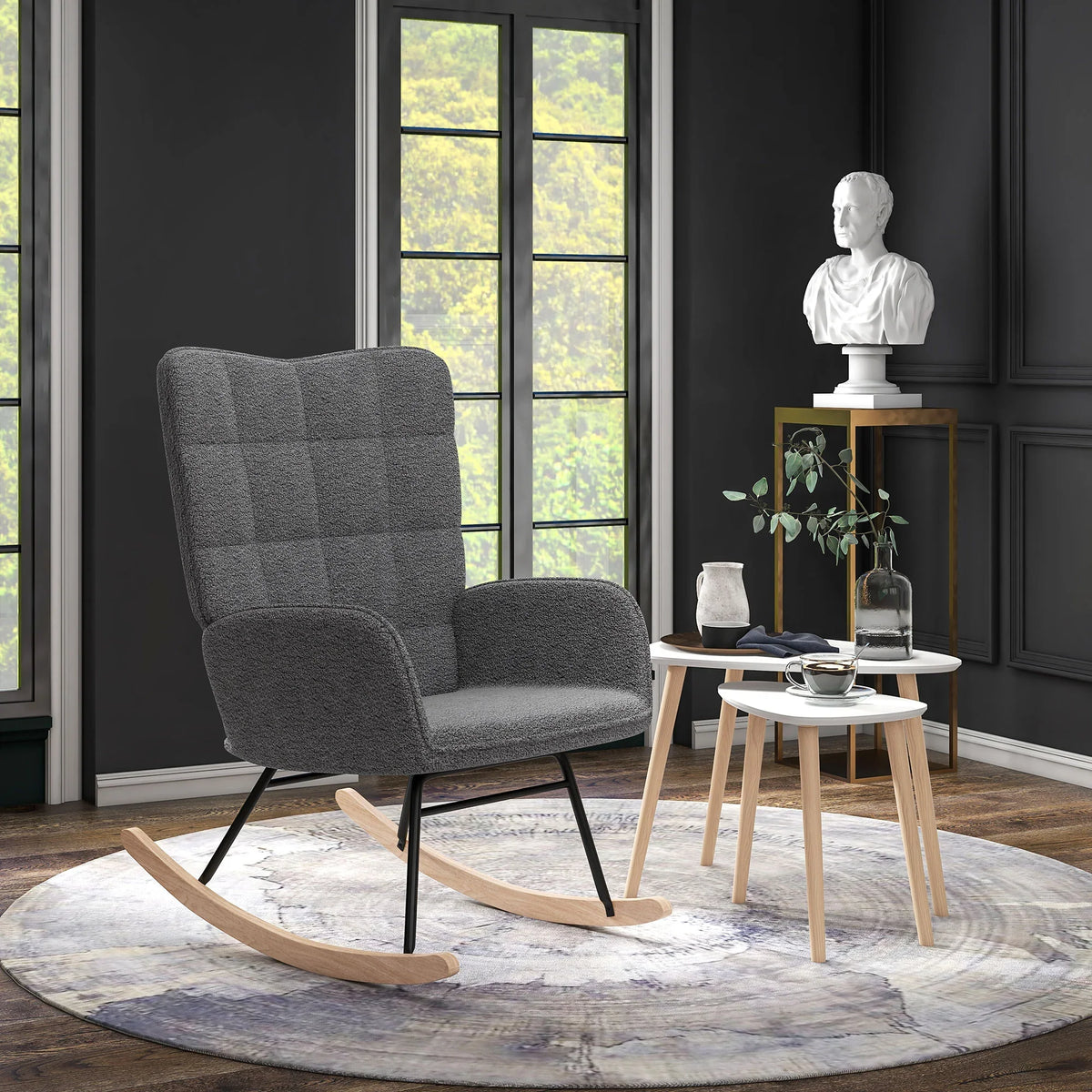 Wingback rocking chair with dark gray fabric and two nesting white coffee tables