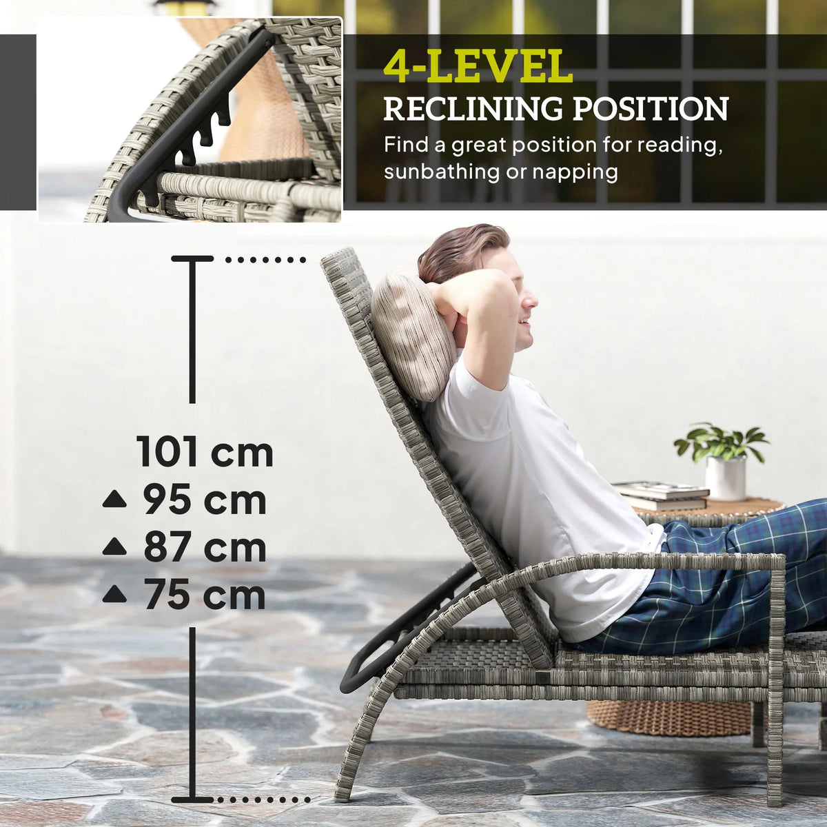 Grey rattan reclining lounger with extended footrest and adjustable back, reclined
