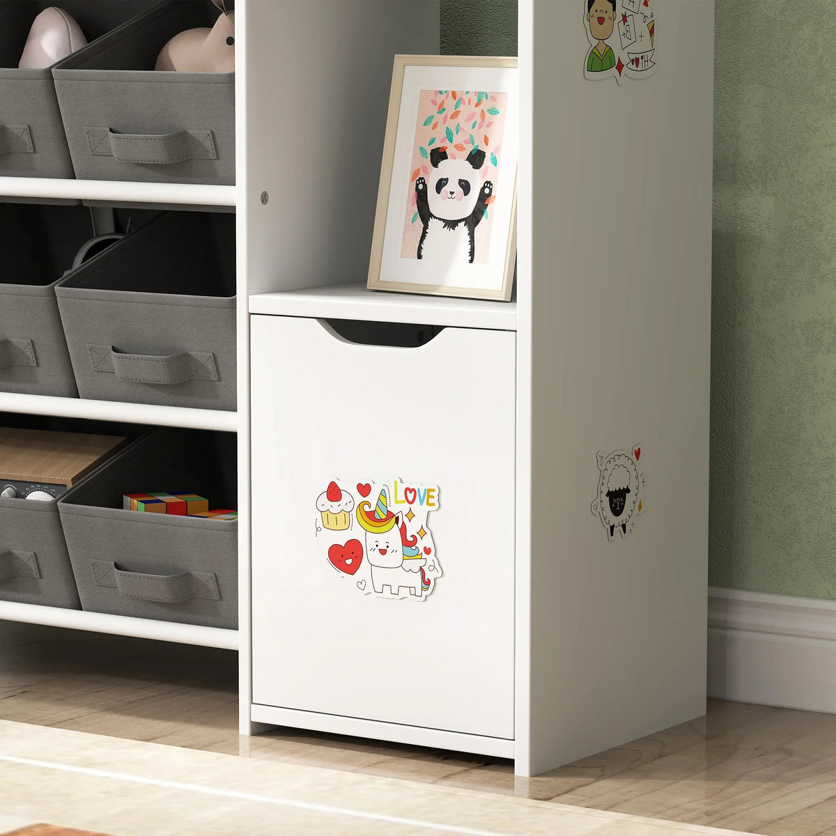 White storage cabinet door on kids toy organizer with animal artwork and rounded handle