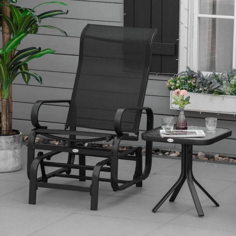 Black gliding rocking chair with mesh back, cushioned seat, and metal frame