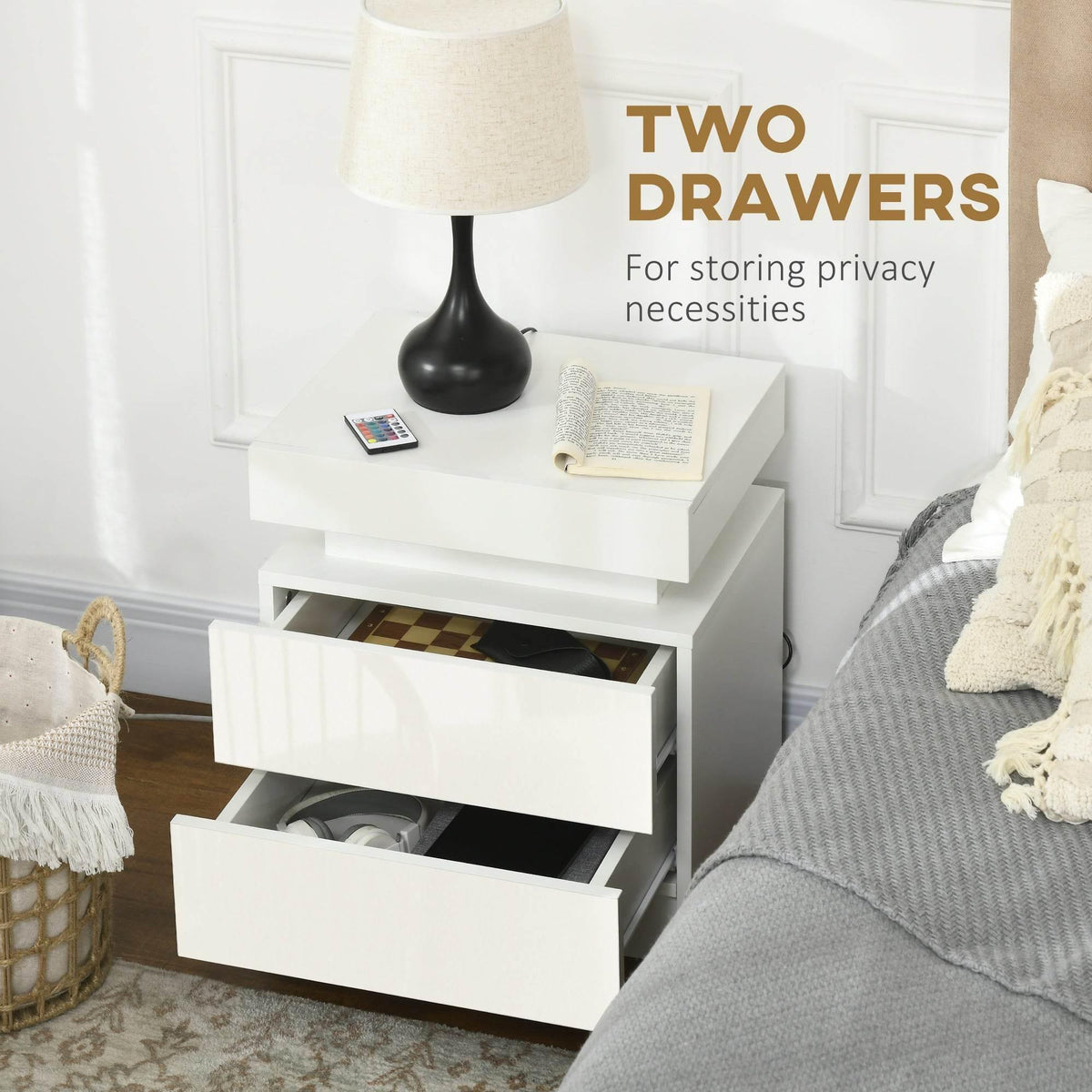 White bedside table with two drawers; top drawer open with black interior for storage