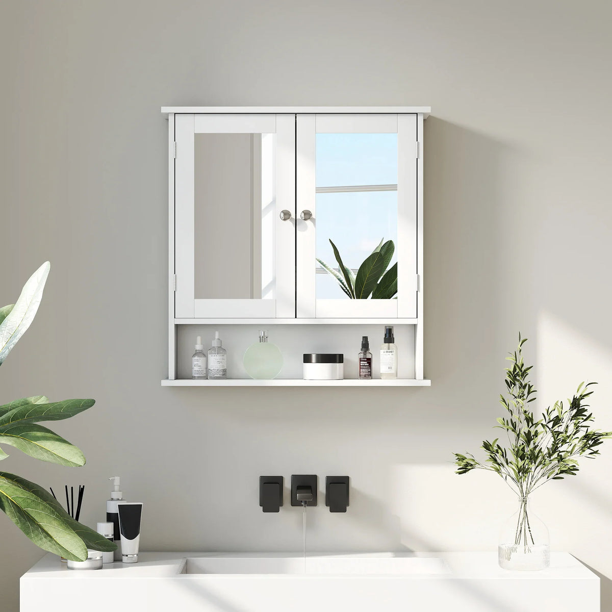 Wall-mounted white bathroom cabinet with mirrored doors and open storage for toiletries